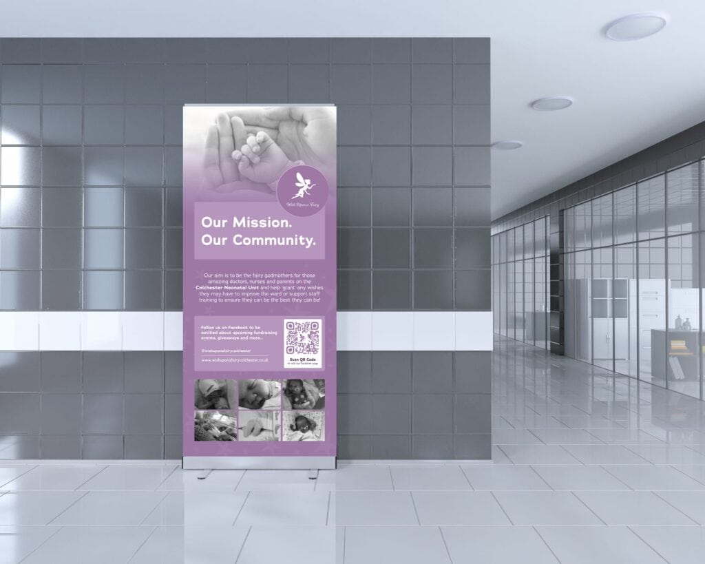 An informational banner standing in a hallway, promoting community mission and involvement, featuring images of human interaction and engagement.