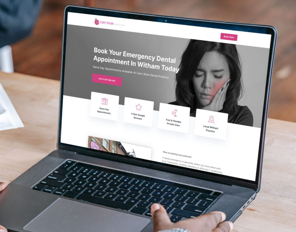 A person browsing an emergency dental appointment booking website on a laptop.