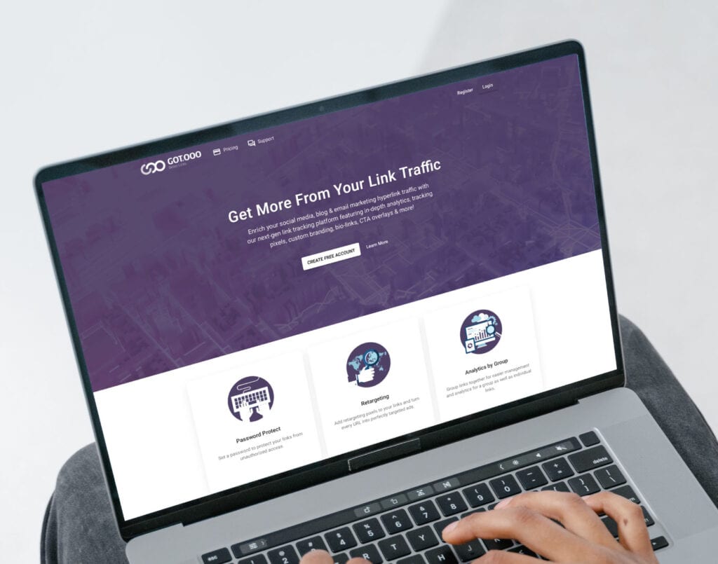 Person browsing a website that offers link traffic optimization services on a laptop.