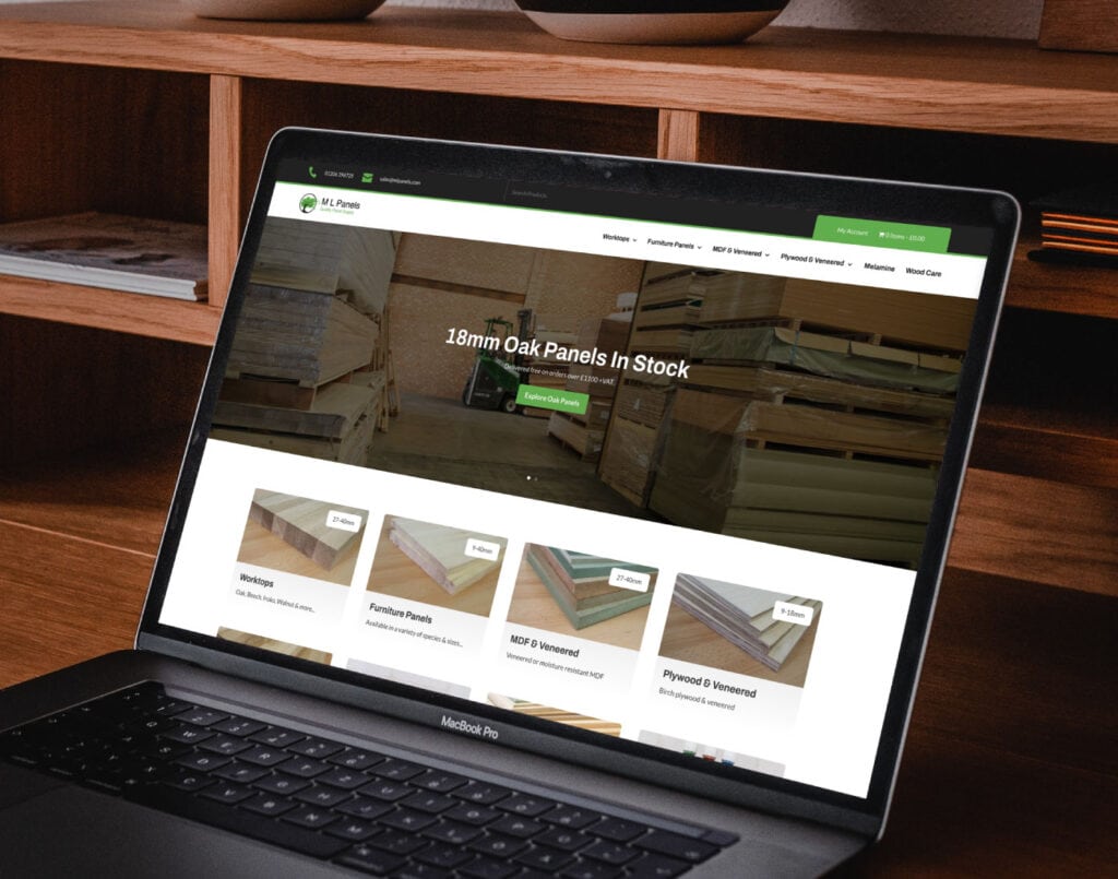 Laptop displaying a wood panel supplier's website with various product listings.