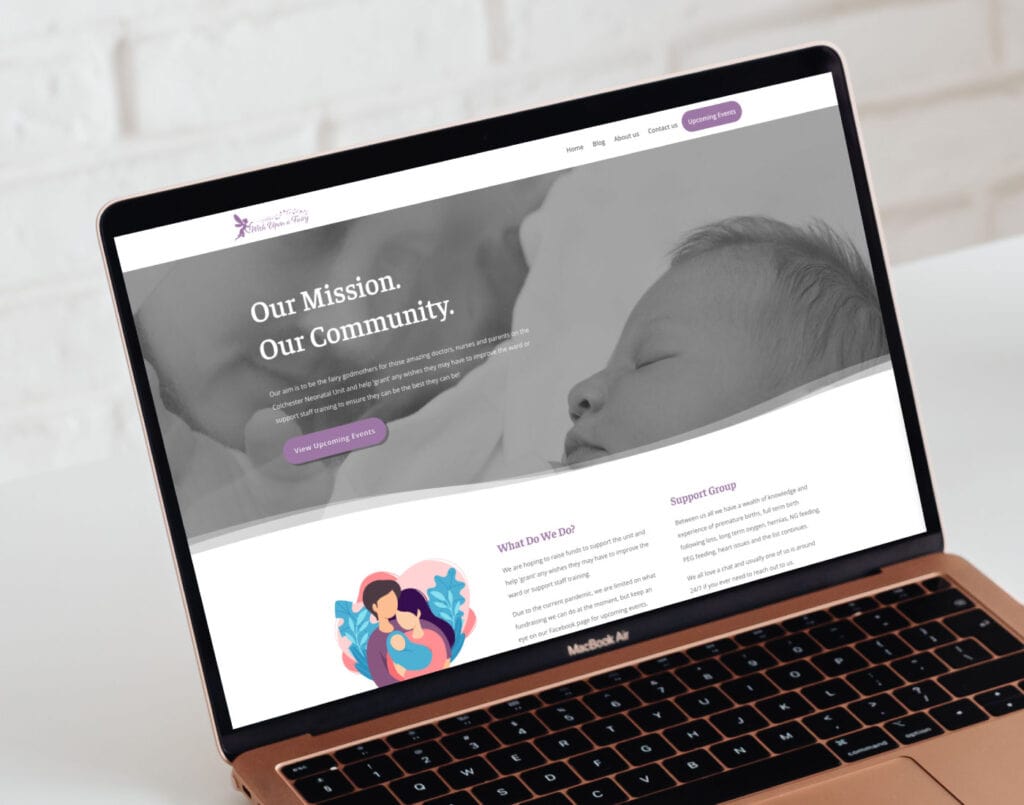 Laptop displaying a non-profit organization's website with a focus on community and support, featuring an image of a sleeping baby.